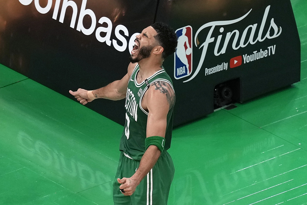 Jayson Tatum celebrates after scoring